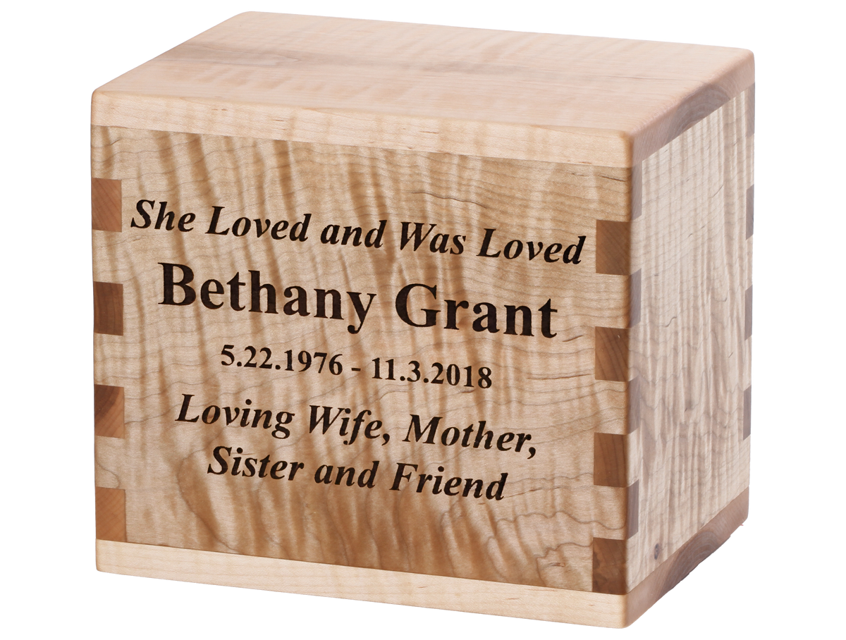 Cremation urn with laser engraving showing a loving sentiment.