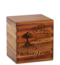 Personalized wooden cremation urn handcrafted in Canarywood with custom laser engraving.