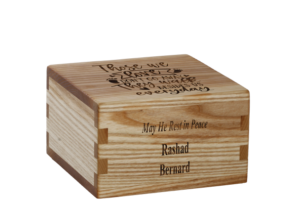 Personalized wooden cremation urn handcrafted in Ash with custom laser engraving.