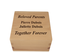 Personalized wooden cremation urn handcrafted in Beech with custom laser engraving.