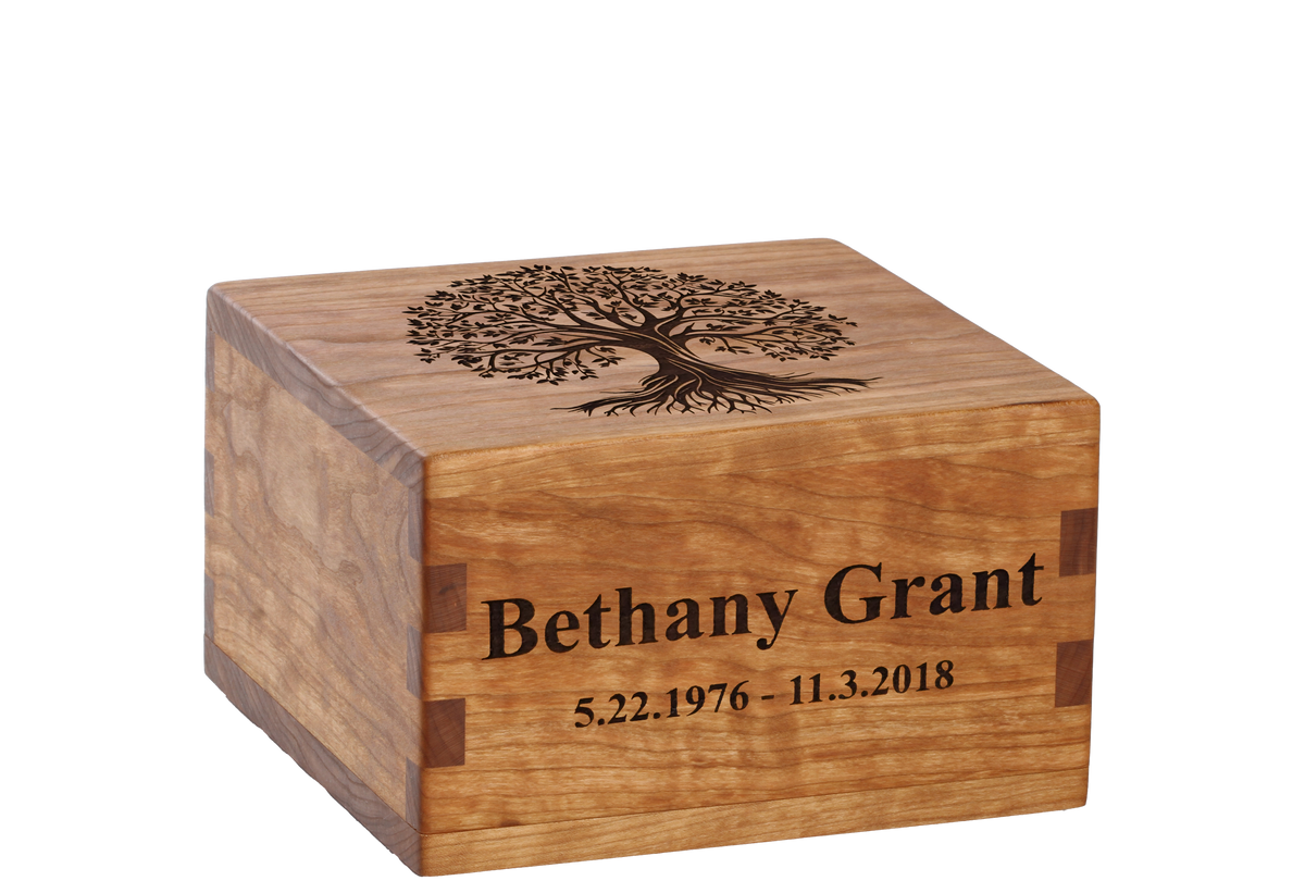 Personalized wooden cremation urn handcrafted in Cherry with custom laser engraving.