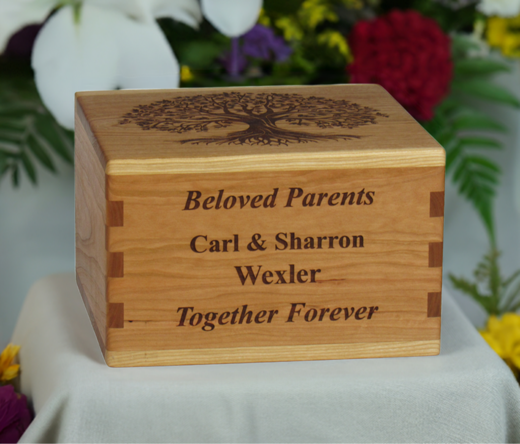 Personalized wooden cremation urn handcrafted in Cherry with custom laser engraving.