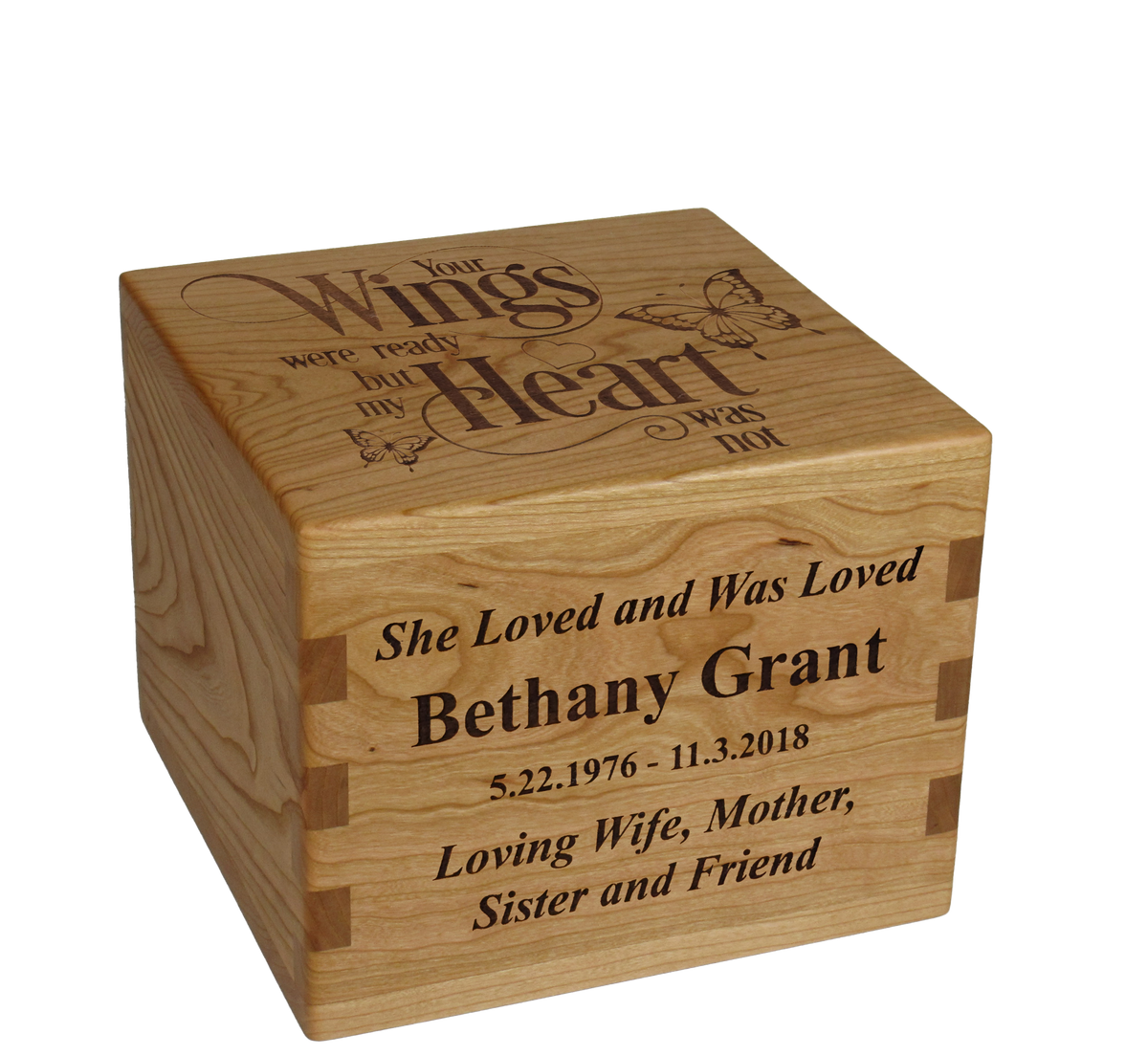 Personalized wooden cremation urn handcrafted in Cherry with custom laser engraving.