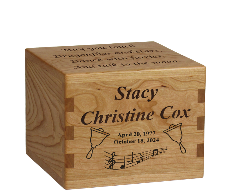 Personalized wooden cremation urn handcrafted in Cherry with custom laser engraving.