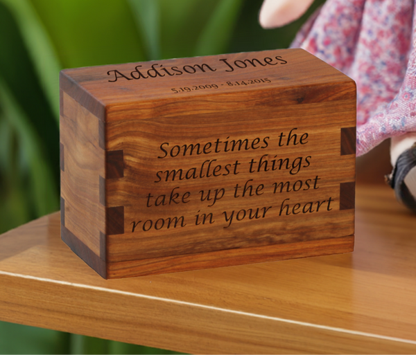 Personalized wooden keepsake cremation urn handcrafted in Canarywood with custom laser engraving.