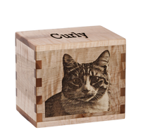 Personalized wooden pet cremation urn handcrafted in Curly Maple with custom laser engraving.