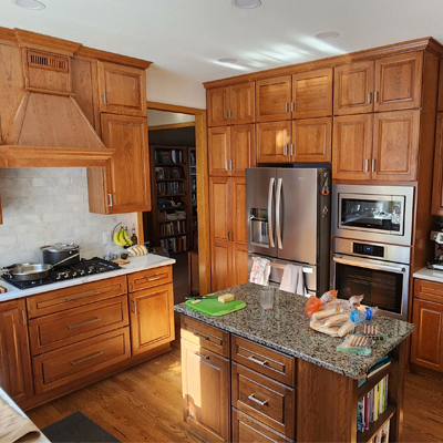 Kitchen remodel featuring custom island and fridge wall.