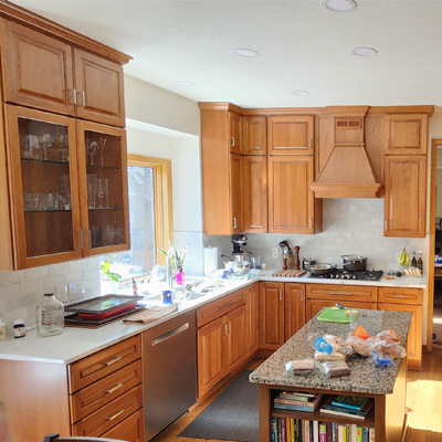 Kitchen remodel featuring custom cabinets and sink wall.