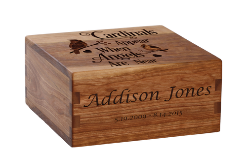 Craftsman cremation urn with personalized laser engraving of cardinals.