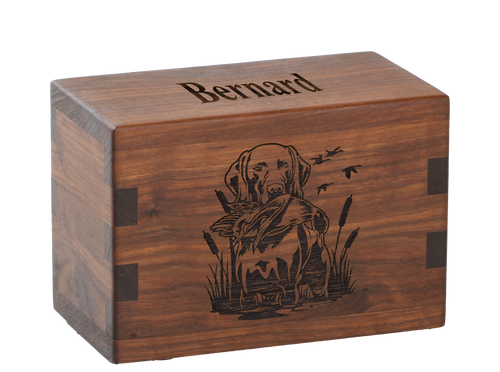 Pet cremation urn with personalized laser engraving of a hunting dog.