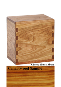 Wood cremation urn handcrafted in Canarywood.